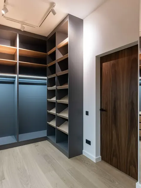Custom walk-in closet with wood shelving